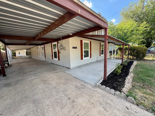 view of home's exterior featuring a carport