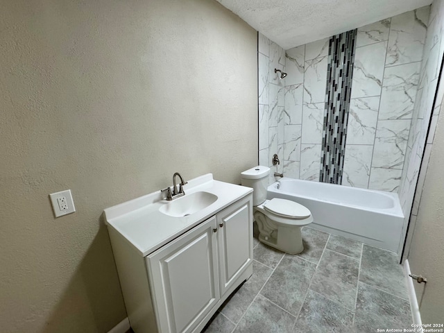 full bathroom with vanity, toilet, tiled shower / bath combo, and a textured ceiling