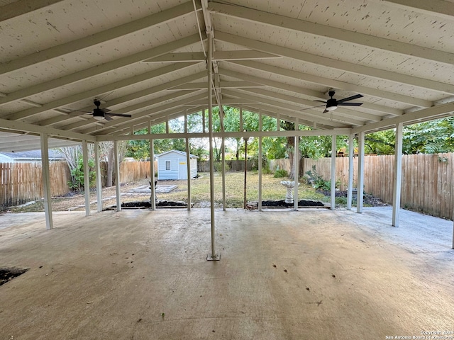 view of patio / terrace featuring a storage shed and ceiling fan