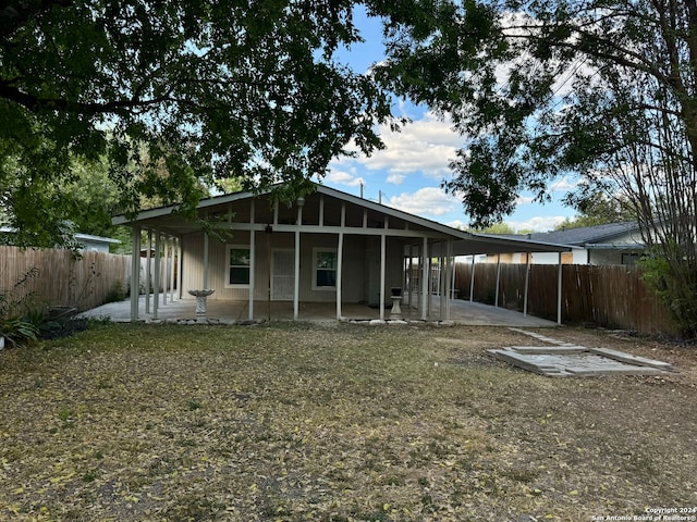 rear view of property featuring a patio