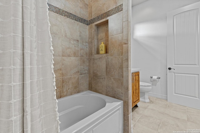 full bathroom with vanity, shower / tub combo with curtain, toilet, and tile patterned flooring