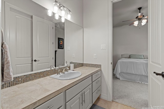 bathroom featuring vanity, ceiling fan, and tile patterned floors