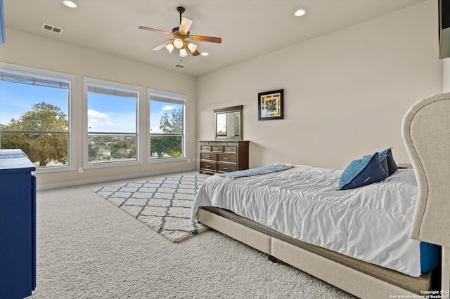 carpeted bedroom with ceiling fan