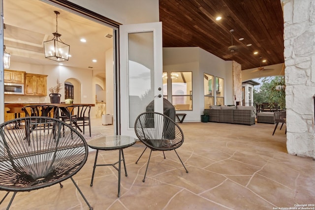 exterior space featuring ceiling fan and an outdoor hangout area