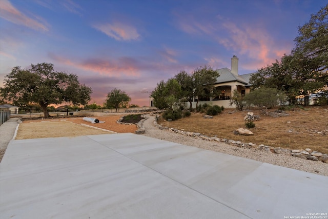 yard at dusk with a patio