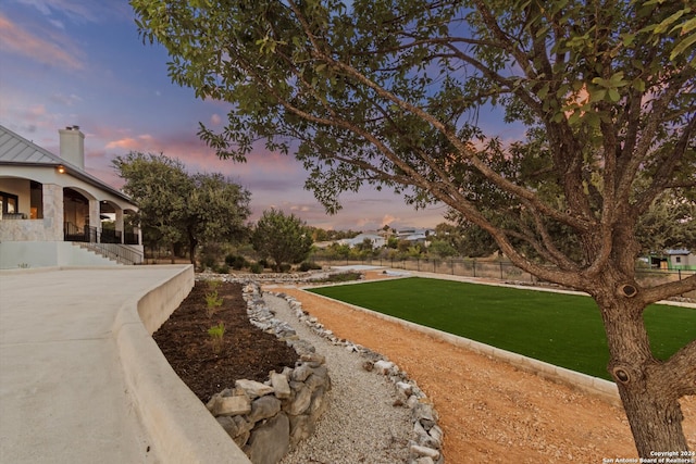 view of yard at dusk