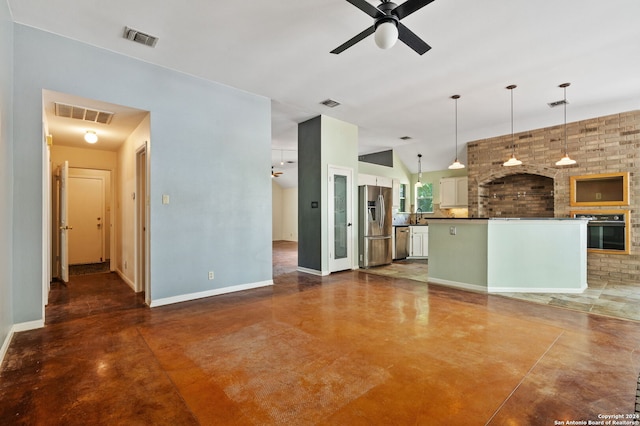 unfurnished living room featuring ceiling fan