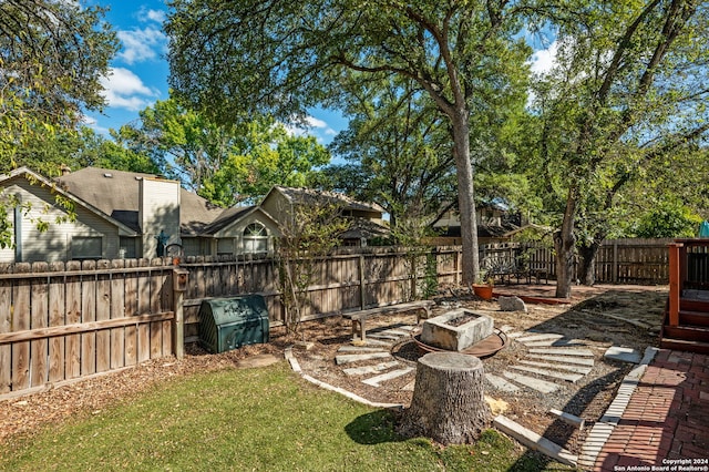 view of yard with an outdoor fire pit