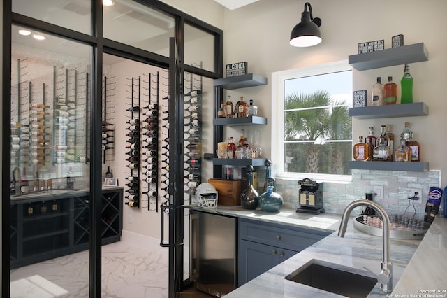 wine room featuring wet bar