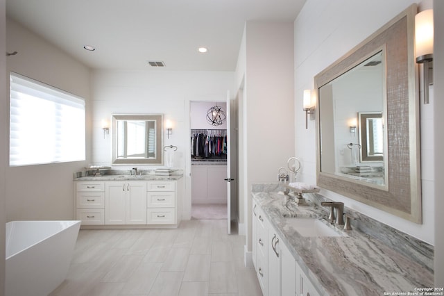 bathroom featuring vanity and a bathing tub