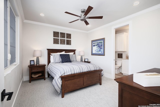 bedroom with ceiling fan, ensuite bath, and crown molding