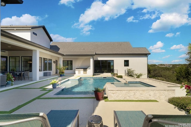 view of pool with an in ground hot tub and a patio area