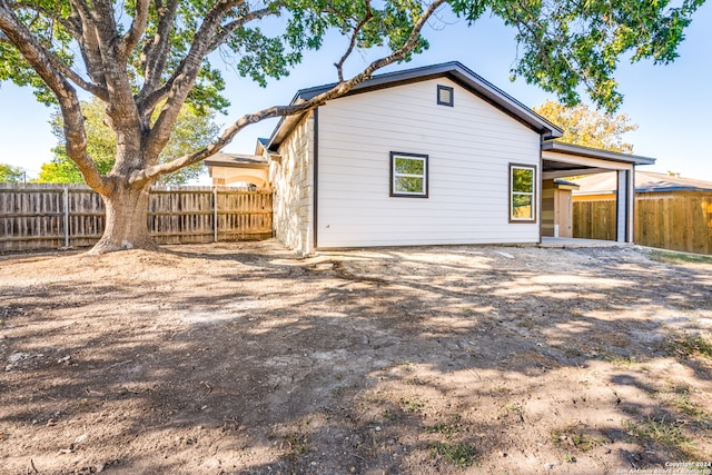 back of house with a patio