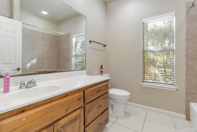 bathroom featuring toilet, vanity, and tile patterned floors