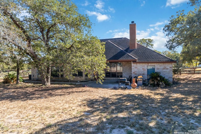 back of property featuring a patio area