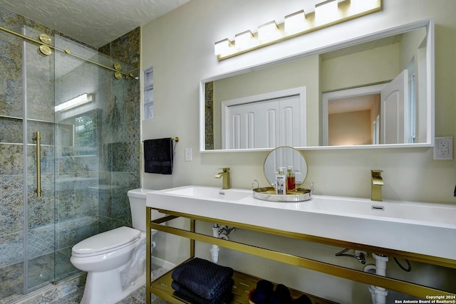 bathroom featuring vanity, toilet, and walk in shower