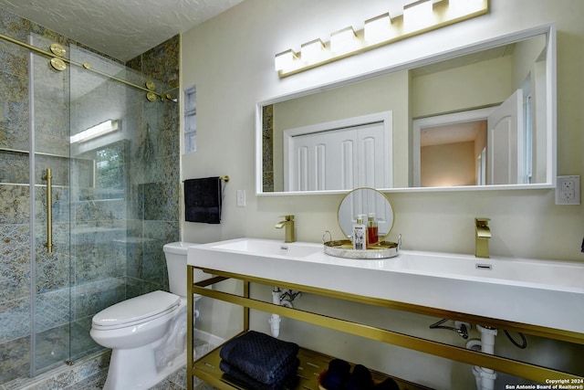 full bath with vanity, toilet, and a shower stall