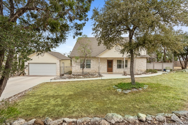 view of front of house featuring a garage and a front lawn