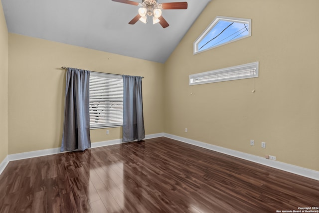 spare room with hardwood / wood-style flooring, high vaulted ceiling, and ceiling fan