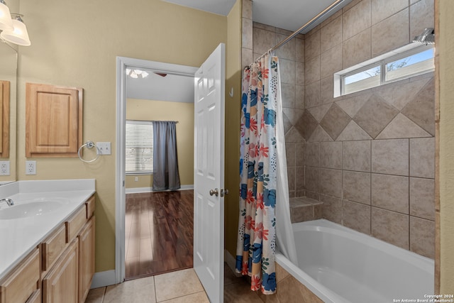 bathroom with vanity, wood-type flooring, shower / bath combo, and plenty of natural light