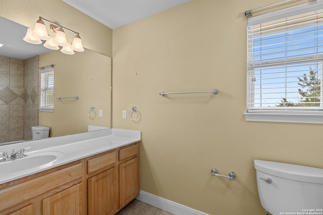 bathroom featuring vanity, toilet, and tile patterned floors