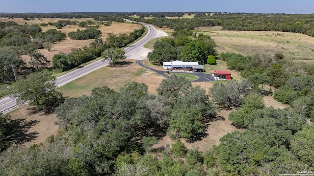 birds eye view of property with a rural view