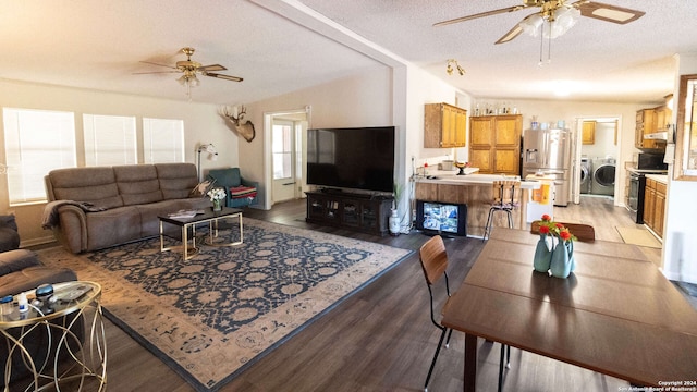 living room with a healthy amount of sunlight, vaulted ceiling, and light wood-type flooring