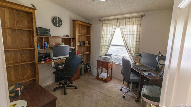 carpeted office featuring a textured ceiling