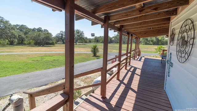 wooden deck with a yard