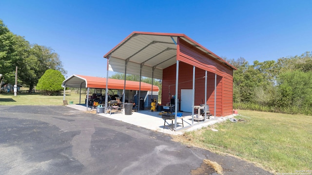 exterior space with a carport