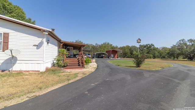 view of front of property with covered porch and a front lawn