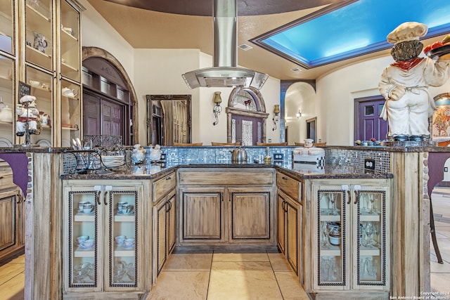 kitchen with dark stone counters and light tile patterned floors