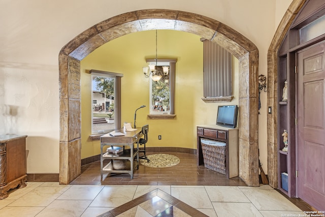 home office with an inviting chandelier