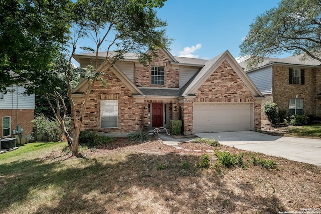 view of front of property featuring central AC, a front lawn, and a garage