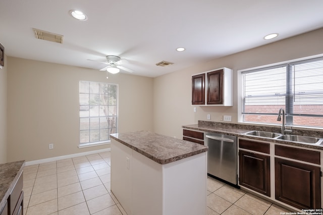 kitchen with light tile patterned flooring, sink, dishwasher, a center island, and ceiling fan