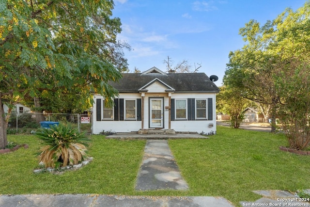 bungalow with a front lawn