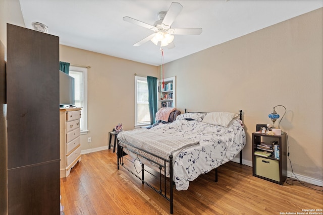 bedroom featuring light hardwood / wood-style floors and ceiling fan