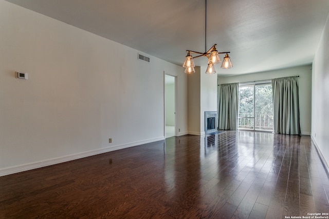 interior space with a chandelier and dark wood-type flooring