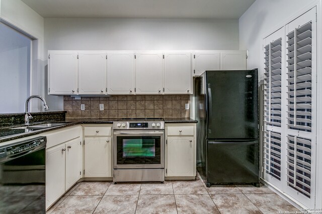 kitchen with sink, black appliances, backsplash, and light tile patterned floors