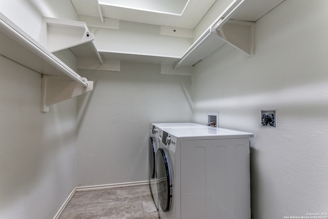 laundry area with washing machine and dryer