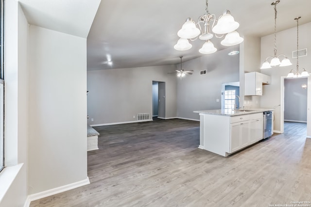 kitchen with lofted ceiling, white cabinetry, wood-type flooring, and ceiling fan with notable chandelier