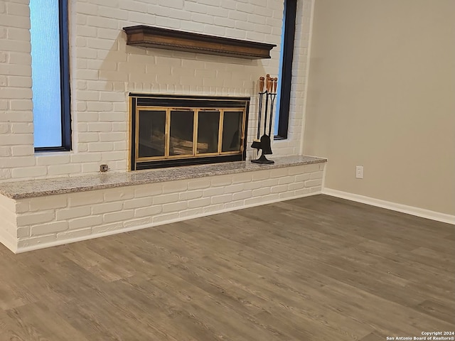 details with a fireplace and hardwood / wood-style floors