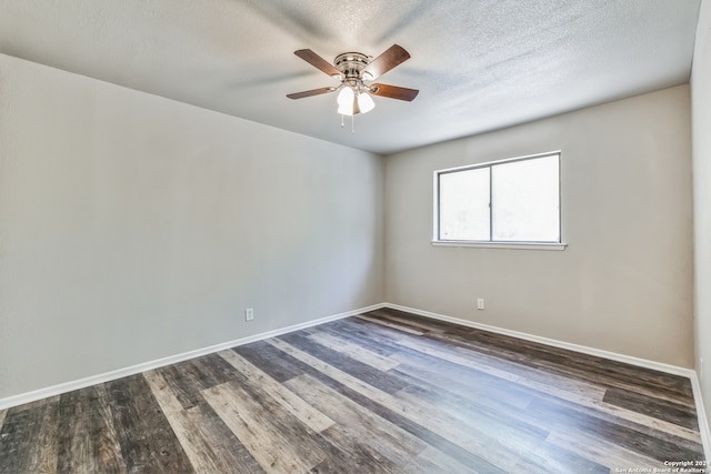 spare room with a textured ceiling, ceiling fan, and dark hardwood / wood-style flooring