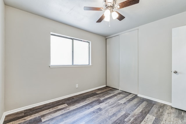 spare room featuring hardwood / wood-style floors and ceiling fan