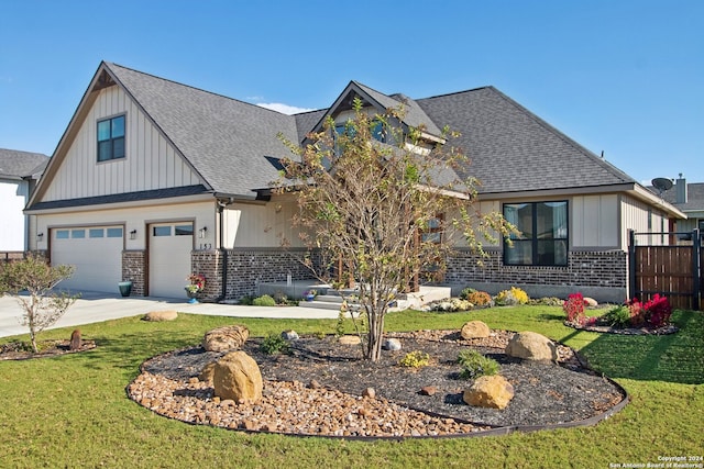 view of front of house featuring a front lawn and a garage