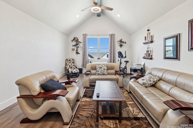 living room with ceiling fan, wood-type flooring, and lofted ceiling