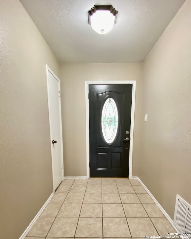 view of tiled entrance foyer