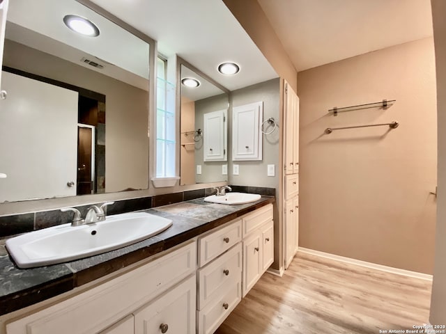 bathroom featuring vanity and hardwood / wood-style floors