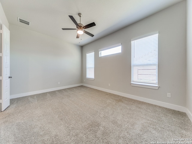 carpeted empty room with ceiling fan