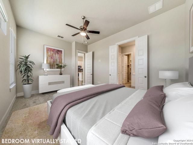 bedroom with ceiling fan and light colored carpet